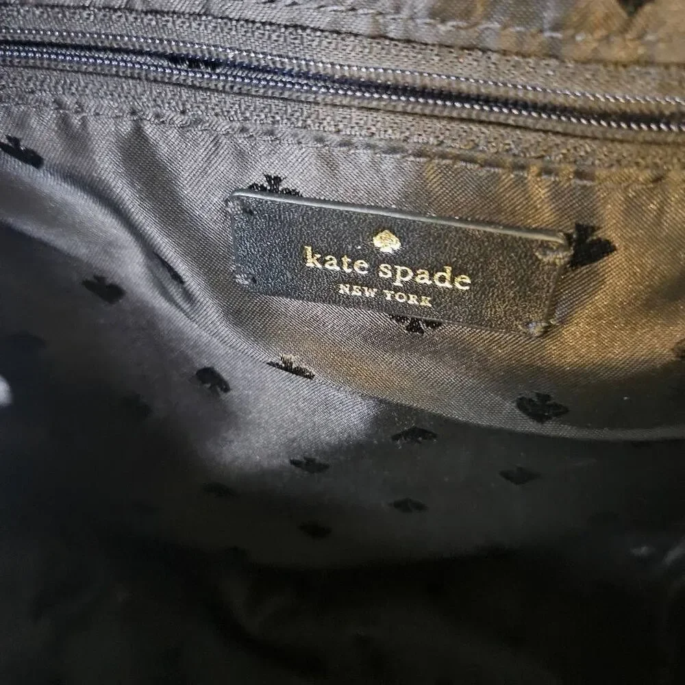 Kate Spade Karissa black nylon backpack, minimalist design.